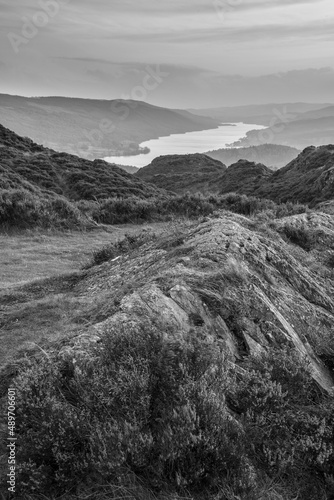 Black and white Majestic Autumn sunset landscape image from Holme Fell looking towards Coniston Water in Lake District