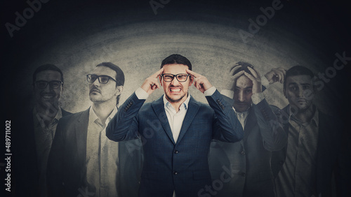 Fotografie Businessman with multipolar disorder splits emotions into different inner personalities