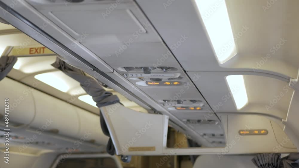 Seat belt sign inside the airplane cabin Seat belt sign inside the airplane cabin