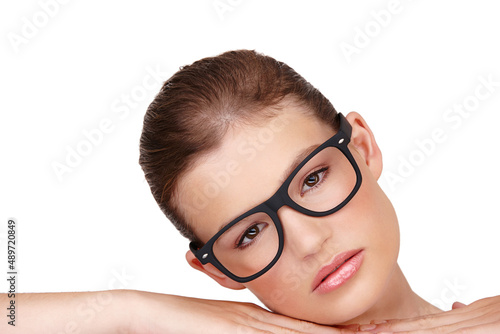 Authoritative Beauty. Studio shot of a beautiful woman wearing thick rimmed glasses isolated on white.