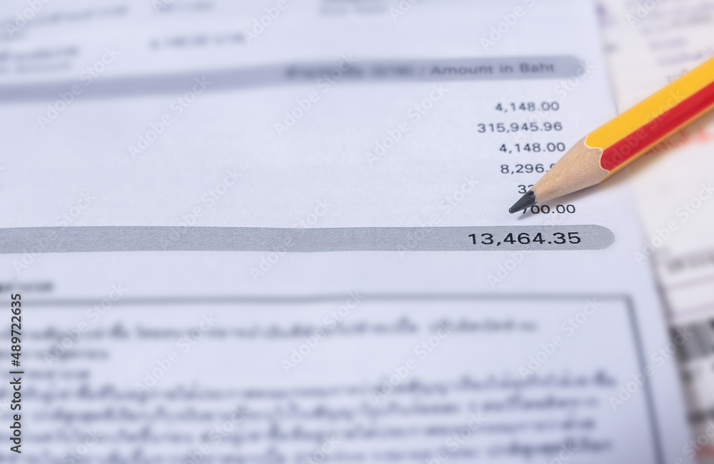 Utility energy bill with pencil blurred background Utility energy bill with pencil blurred background