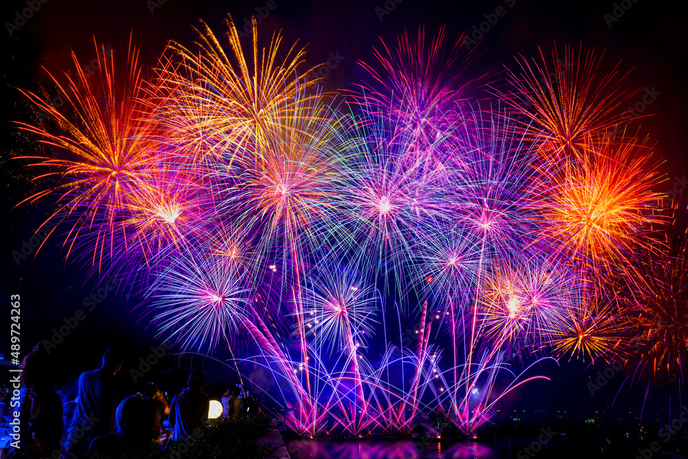 The crowd of Silhouette watching firework isolated display for celebration happy new year and merry christmas on black isolated background The crowd of Silhouette watching firework isolated display for celebration happy new year and merry christmas on black isolated background