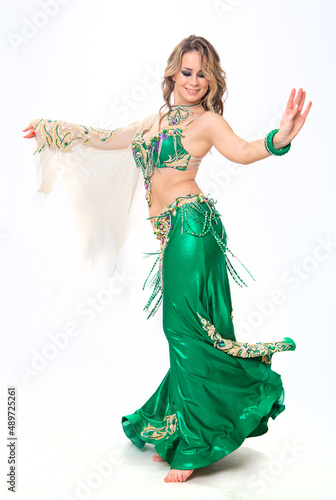 Young beautiful woman dancing belly dance