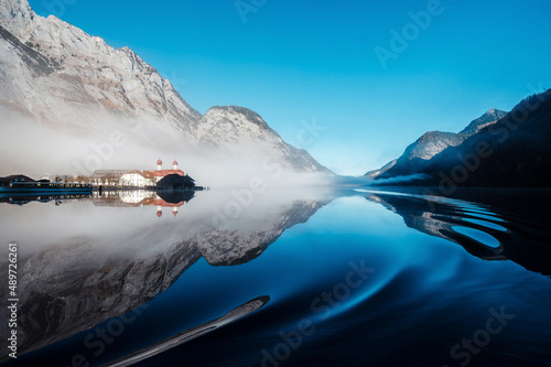 Amazing view of lake Konigsee with church and rocky alps photo