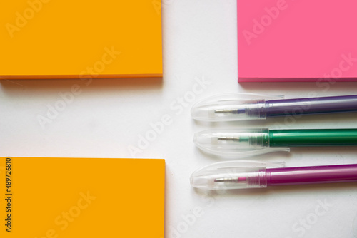 White sheet of paper with a fountain pen and ink on a blue background, mock up