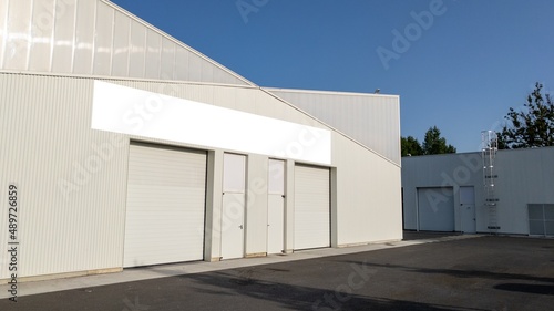 Wall facade industrial building company with blank signage empty banner ready for text brand artwork mockup