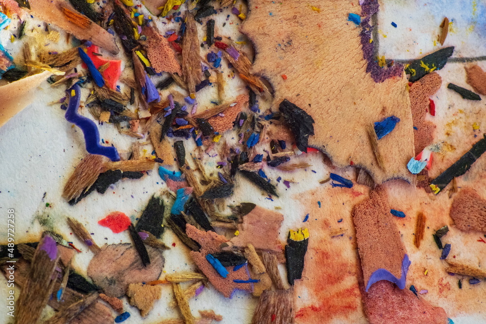 Multicolored cleaning-sawdust from pencils close-up