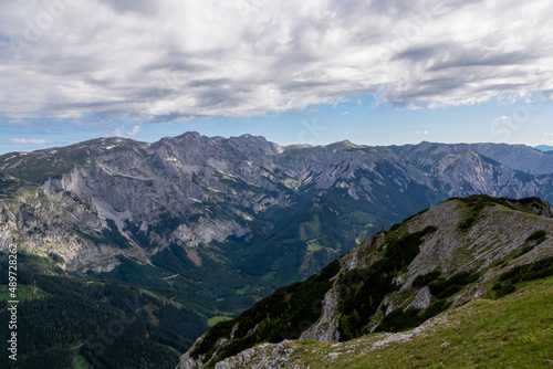 Panoramic view on the alpine mountain chains in Styria, Austria, Hochschwab region. Hills overgrown with small bushes, higher parts rocky and bare. Sunny summer day. Serenity. Hiking in Alps, Tragoess © Chris