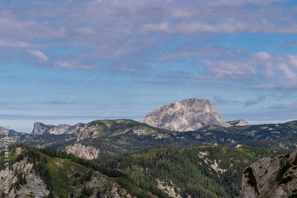 Panoramic view on Brandstein in the alpine mountain chains in Styria, Austria, Hochschwab region. Hills overgrown with small bushes, higher parts rocky and bare. Summer day. Hiking in Alps,Tragoess