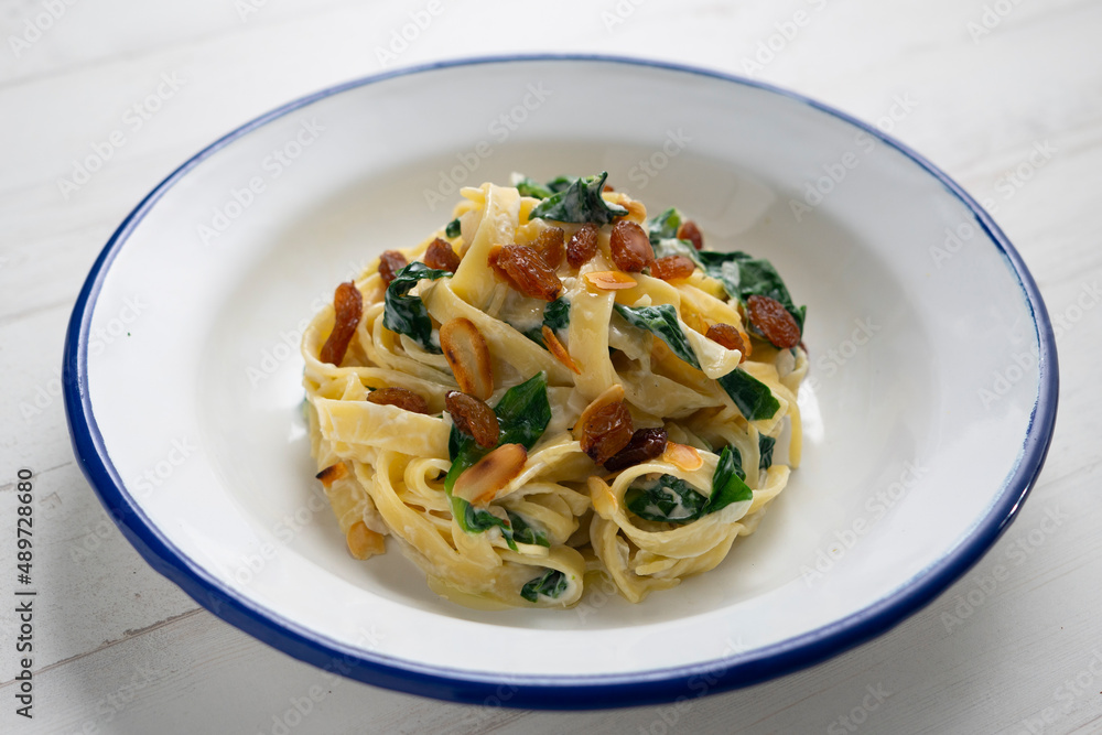 Pasta with chard and raisins. Traditional Italian recipe. Pasta with chard and raisins. Traditional Italian recipe.