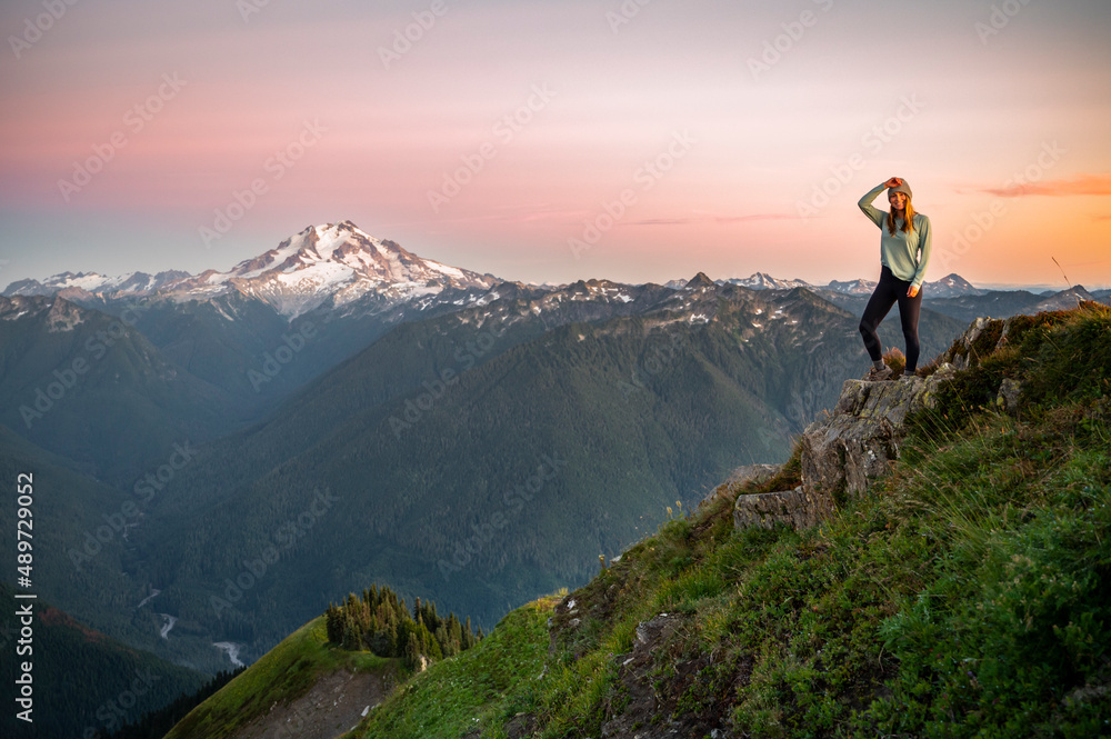 Fit female posing on a cliff at Green Mountain Lookout Fit female posing on a cliff at Green Mountain Lookout