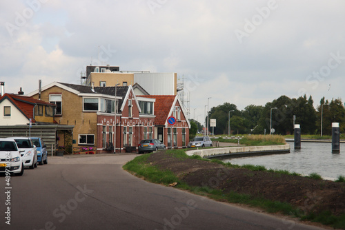Fototapeta Naklejka Na Ścianę i Meble -  Old houses on Wilhelminakade along the Gouwe in Waddinxvee