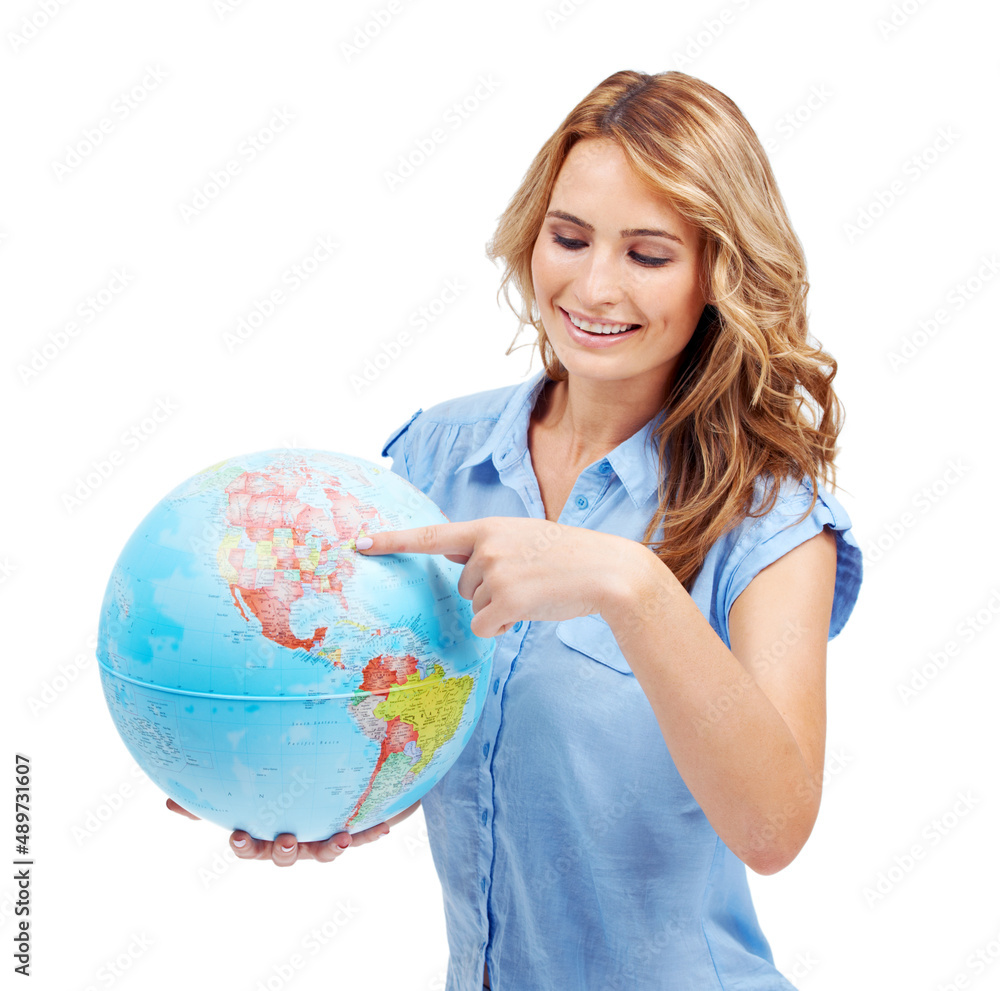 Fototapeta premium Theres so much to explore - Travel Tourism. A pretty young woman pointing to the East Coast of North America on a world globe.