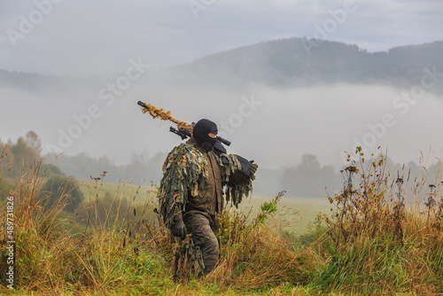 Sniper with camouflage going to firing post, illustration for war
