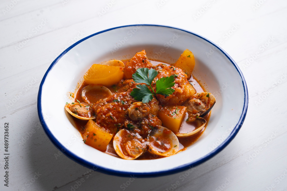 Cod with potatoes and clams. Traditional recipe from the north of Spain. Cod with potatoes and clams. Traditional recipe from the north of Spain.