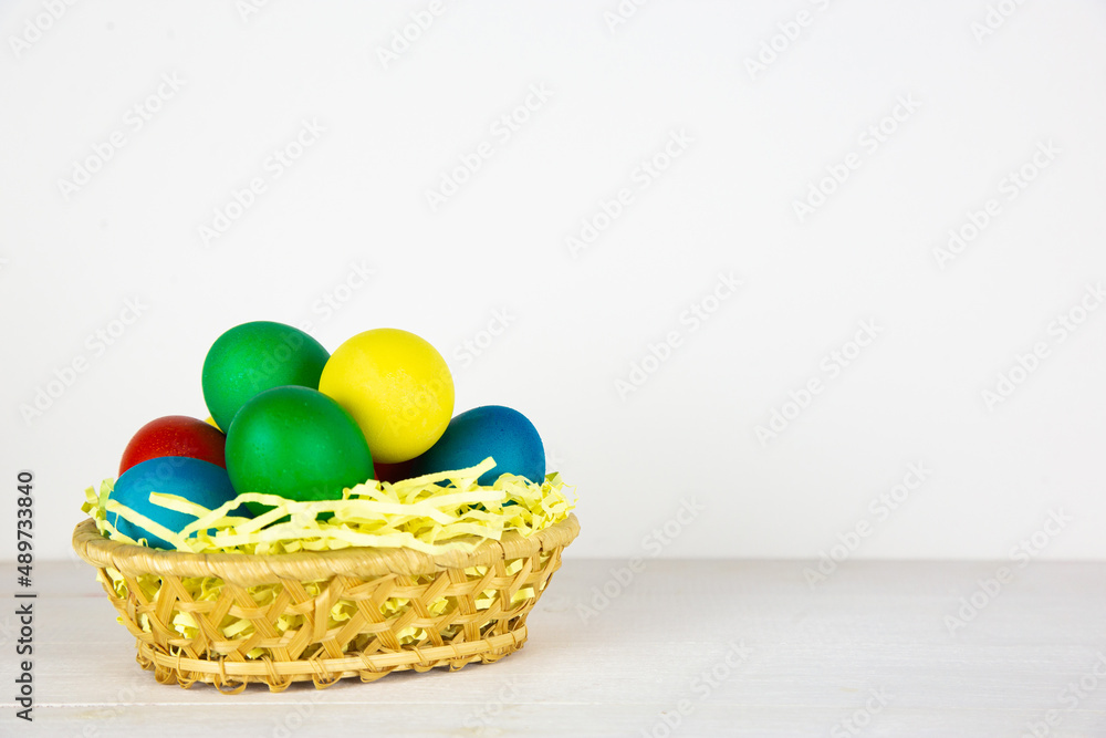 Easter eggs in brown bowl. Happy Easter holiday. Colorful painted eggs. Bright boiled eggs. Easter eggs in brown bowl. Happy Easter holiday. Colorful painted eggs. Bright boiled eggs.