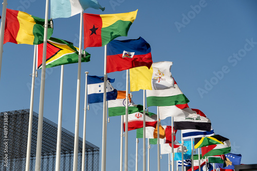 Photography Close up of world flags flying in a row outside of expo center in 2020 waving on