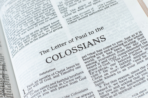 Colossians open Holy Bible Book close-up. New Testament Scripture. Studying the Word of God Jesus Christ. Christian biblical concept of faith, hope, and trust. 