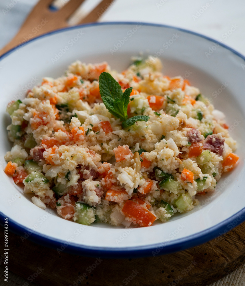 Fake couscous made with crushed cauliflower, green pepper and other vegetables. vegan recipe. Fake couscous made with crushed cauliflower, green pepper and other vegetables. vegan recipe.