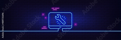 Neon light glow effect. Spanner tool line icon. Monitor or computer repair service sign. Fix instruments symbol. 3d line neon glow icon. Brick wall banner. Monitor repair outline. Vector