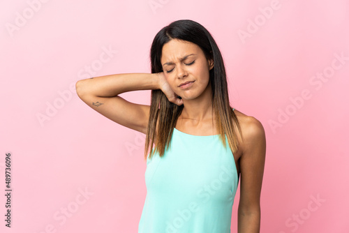 Caucasian girl isolated on pink background with neckache