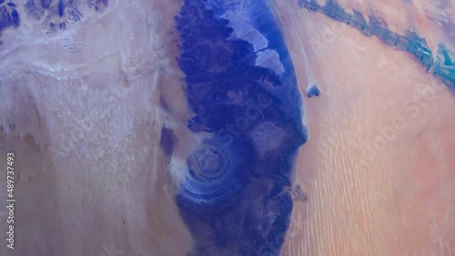 Richat structure, eye of the Sahara aerial satellite view from space. Sunrise animation based on image by Nasa