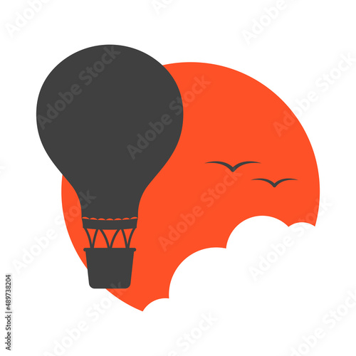 Hot air balloon travel logo. An image of a soaring hot air balloon among the sun and clouds. Vector illustration.