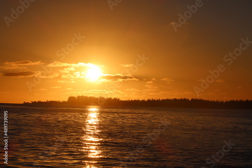 sunset over the sea in Tetiaroa in a pacific island fron French Polynesia 