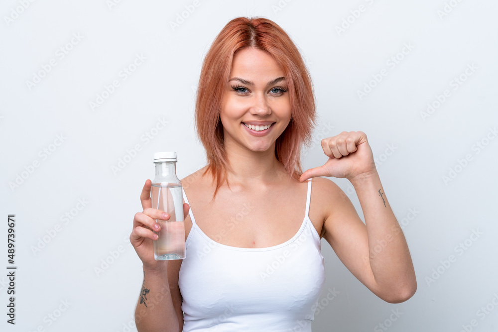 Young Russian girl with a bottle of water isolated on white background proud and self-satisfied Young Russian girl with a bottle of water isolated on white background proud and self-satisfied