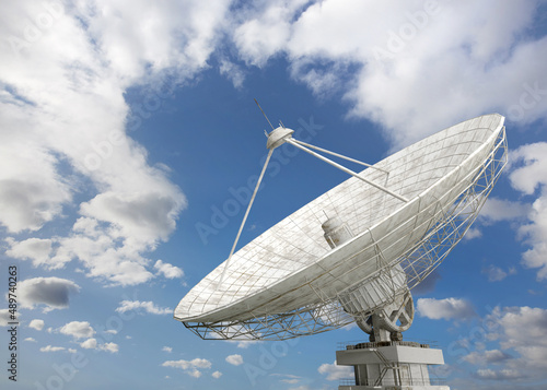 3d model of a parabolic antenna for transmitting and receiving information against the background of a cloudy sky photo