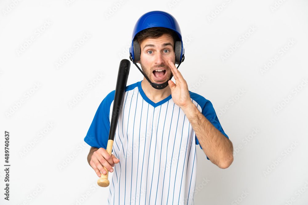 Young caucasian man playing baseball isolated on white background with surprise and shocked facial expression