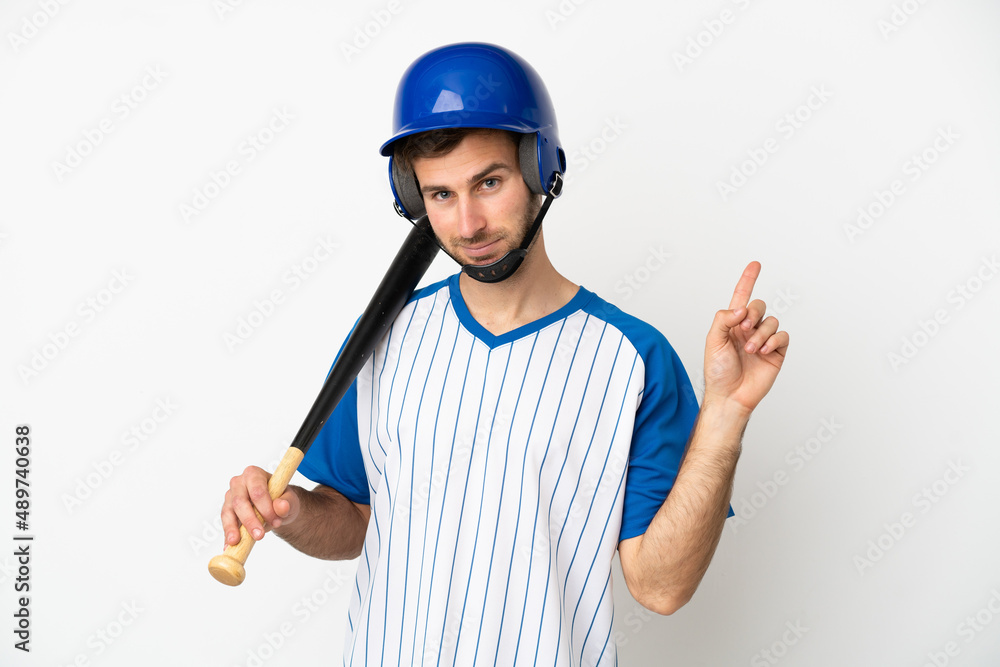 Young caucasian man playing baseball isolated on white background showing and lifting a finger in sign of the best Young caucasian man playing baseball isolated on white background showing and lifting a finger in sign of the best