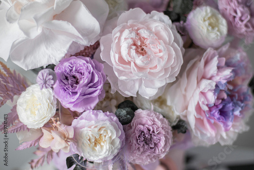 Beautiful box with peonies and roses in a pink box on grey background coffee table. Bouquet of tenders peonies a girl for mother's day, valentine's day, Woman's day 8 march.