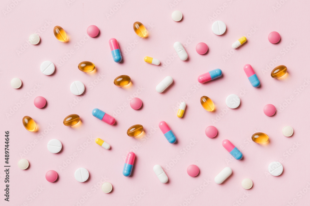 Many different pills and space for text on colorful background, top view. Different pills on color background, flat lay Many different pills and space for text on colorful background, top view. Different pills on color background, flat lay