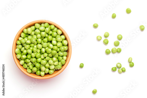 Green peas in a ceramic plate on a white background photo