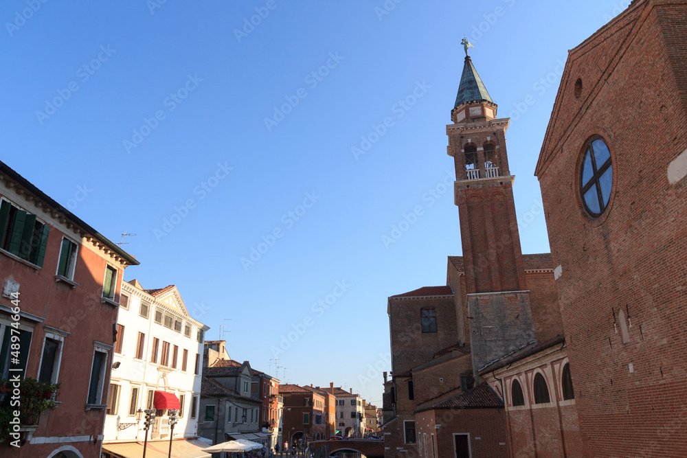 View of town Chioggia with church steeple of Chiesa della Santissima Trinita in Veneto, Italy