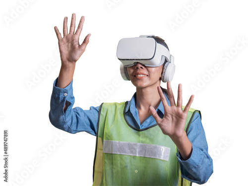 Asian Female warehouse supervisor using virtual reality headset doing inventory counting in the warehouse. The concept of modern technologies.