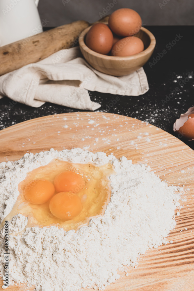 Flour and eggs as ingredients for making pasta dough Flour and eggs as ingredients for making pasta dough