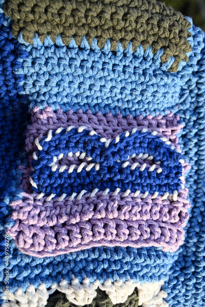 Knitting is a method by which yarn is manipulated to create a textile, or fabric. It is used to create many types of b . Knitting is a method by which yarn is manipulated to create a textile, or fabric. It is used to create many types of b .