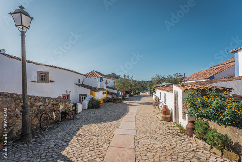Fototapeta Naklejka Na Ścianę i Meble -  Main Street of small traditional Portuguese village in Lisbon region