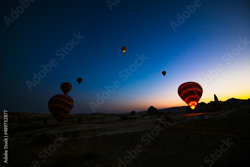 Silhouette of Hot Air Balloons at sunrise in Cappadocia.
