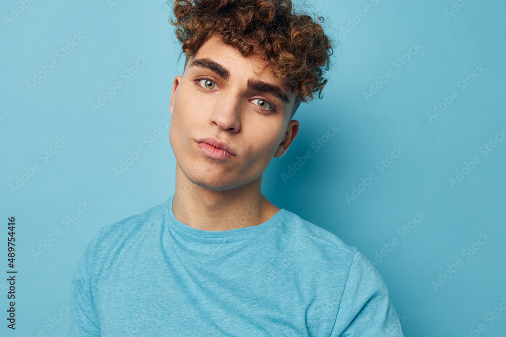 Fototapeta premium handsome guy in blue t-shirts with a pumped-up body unaltered