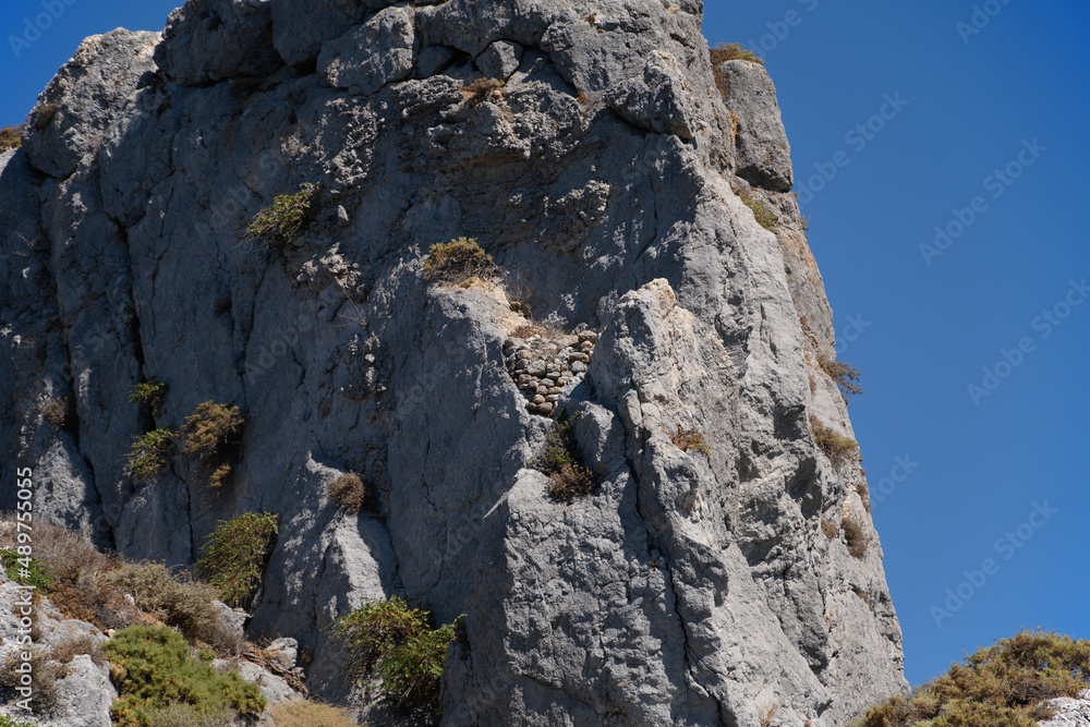 rocks on the small island of Kastri near Kefalos town, Kos island (Greece) rocks on the small island of Kastri near Kefalos town, Kos island (Greece)