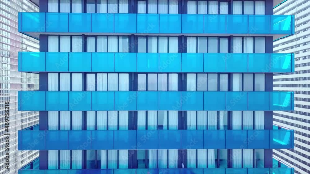facade of a modern office building is removed from drone. close-up. drone rises and falls next to mirrored windows and balconies. Close-up shooting of the building. Real estate and architecture. facade of a modern office building is removed from drone. close-up. drone rises and falls next to mirrored windows and balconies. Close-up shooting of the building. Real estate and architecture.