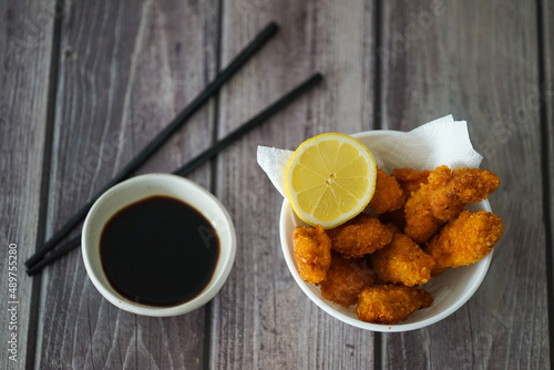 Crispy Fried Chicken Garnished with Lemon