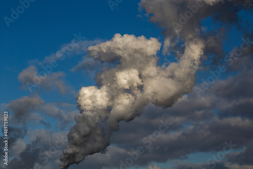 renewable energy or fossil fuels, smoke rises from the chimney of an coal-fired power station
