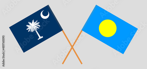Crossed flags of The State of South Carolina and Palau. Official colors. Correct proportion