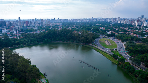 Aerial view of Ibirapuera Park in São Paulo, Brazil. Park with preserved green area. Residential and commercial buildings in the background © Pedro