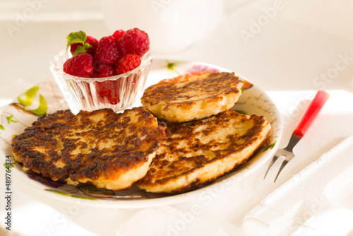 Closeup pancakes and raspberry on a plate breakfast morning food eat yummy dessert sweet bakery pastry baked nobody cafe kitchen berry isolated berry