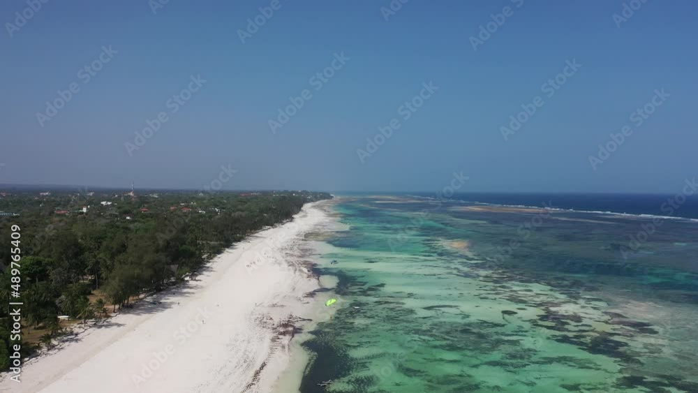 wind kitesurfing kitebording on water sea Drone view Coastline Diani beach landscape Kenyan African Sea aerial 4k waves indan ocean tropical mombasa turquoise white sand East Africa palms paradise wind kitesurfing kitebording on water sea Drone view Coastline Diani beach landscape Kenyan African Sea aerial 4k waves indan ocean tropical mombasa turquoise white sand East Africa palms paradise
